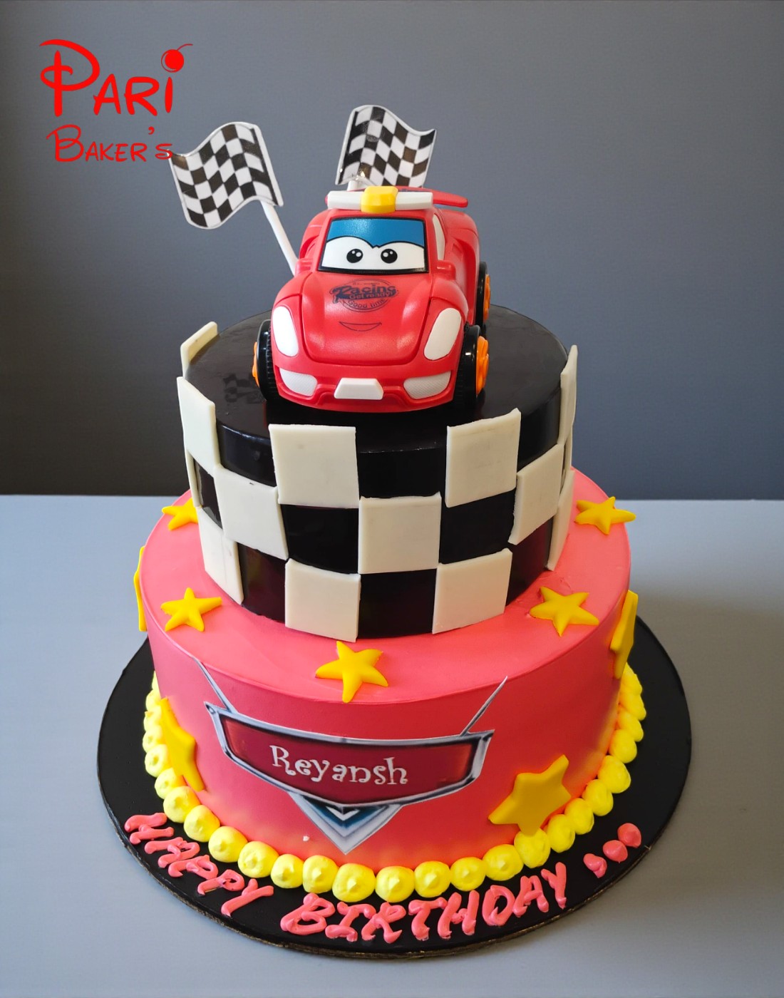 red & black toy car 2 tier cake red & black toy car 2 tier cake